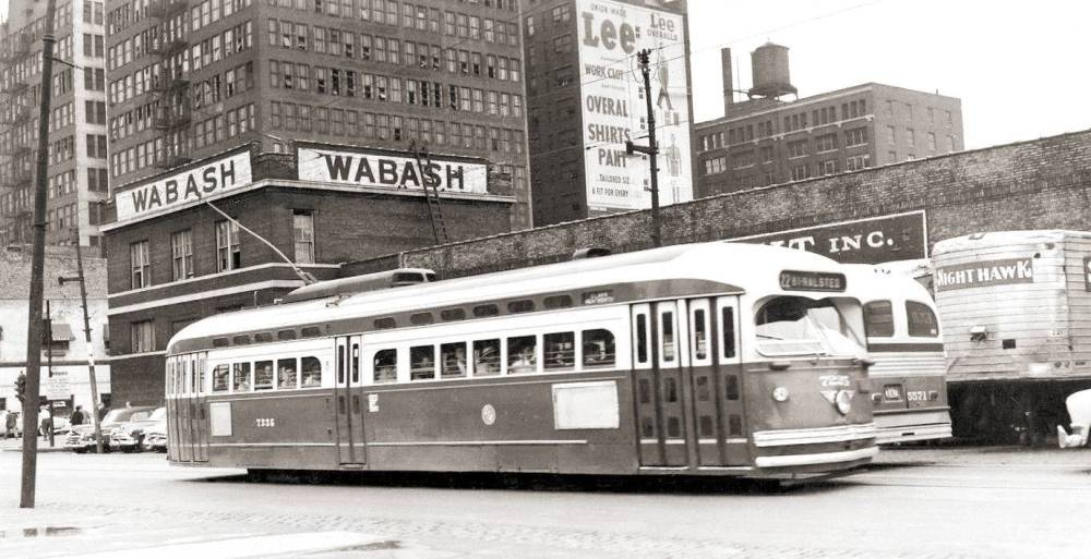 PHOTO - CHICAGO - CLARK AT POLK - PCC STREETCAR PASSING BUS - NOTE SIGN FOR LEE OVERALLS - 1954