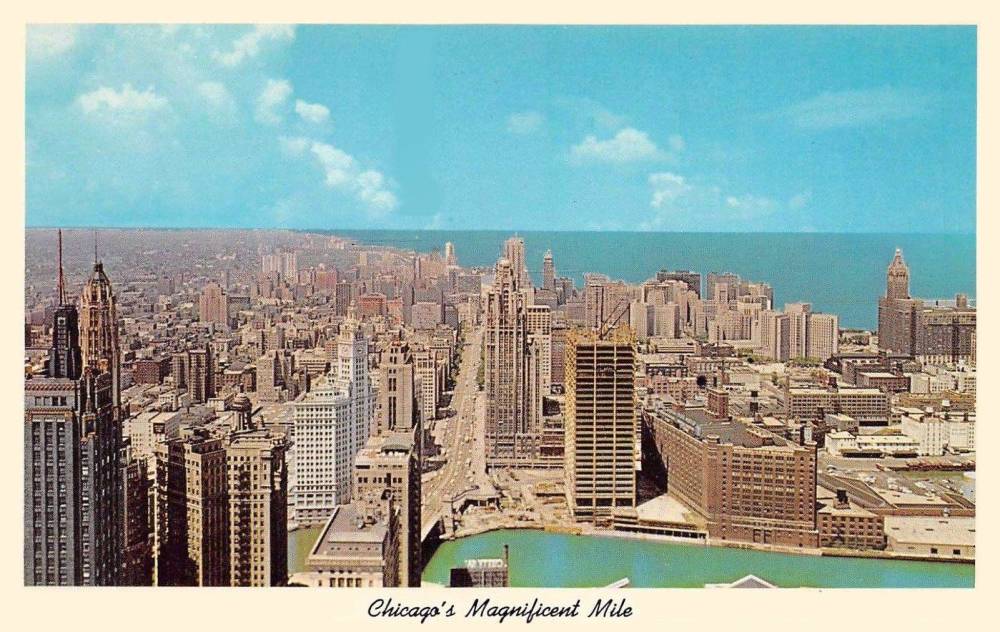 A POSTCARD - CHICAGO - CALLED CHICAGO'S MAGNIFICENT MILE - AERIAL PANORAMA LOOKING N FROM S SIDE OF RIVER - BUILDINGUNDER CONSTRUCTION NEAR RIVER IS THE EQUITABLE COMPLETED IN 1965