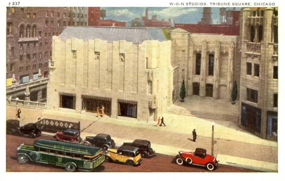 A POSTCARD - CHICAGO - WGN RADIO BUILDING AND STUDIOS - MICHIGAN AVE AT TRIBUNE TOWER - AERIAL - TRAFFIC ON STREET - TINTED - 1920s