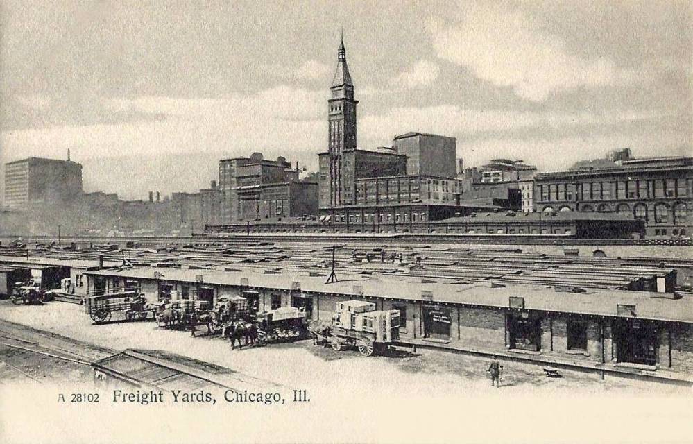 xx postcard - chicago - looking towards michigan ave from freight yards - slightly elevated - wagons loading - michigan ave skyline in distance - c1905