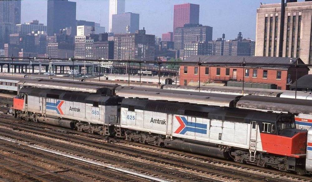 PHOTO - CHICAGO - AMTRACK DIESEL TRAIN UNITS ON TRACKS NEAR UNION STATION - ELEVATED VIEW - SOME SKYLINE IN BACKGROUND - 1978