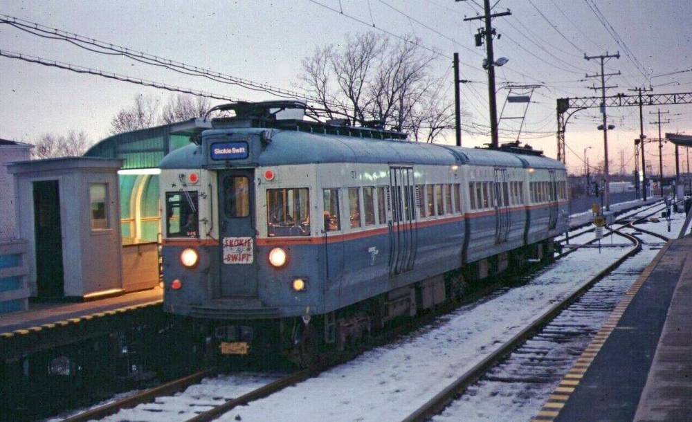 A PHOTO - CHICAGO - CTA'S SKOKIE SWIFT COMMUTER TRAIN AT DEMPSTER STATION - EARLY MORNING HOURS - 1974